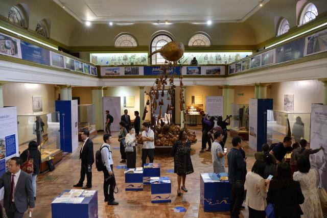 (251219) -- NAIROBI, Dec. 19, 2025 (Xinhua) -- People visit a photo exhibition commemorating the 620th Anniversary of Zheng He's Voyages and the 62nd anniversary of the establishment of China-Kenya diplomatic relations, in Nairobi, Kenya, Dec. 19, 2025. TO GO WITH "Kenya holds photo exhibition to mark 620th anniversary of Zheng He's voyages" (Xinhua/Liu Qiong)