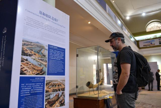 (251219) -- NAIROBI, Dec. 19, 2025 (Xinhua) -- A man visits a photo exhibition commemorating the 620th Anniversary of Zheng He's Voyages and the 62nd anniversary of the establishment of China-Kenya diplomatic relations, in Nairobi, Kenya, Dec. 19, 2025. TO GO WITH "Kenya holds photo exhibition to mark 620th anniversary of Zheng He's voyages" (Xinhua/Liu Qiong)