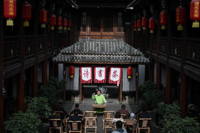 (251219) -- GUANGYUAN, Dec. 19, 2025 (Xinhua) -- Gou Huan, an inheritor of the intangible cultural heritage of traditional Chinese storytelling, performs in Zhaohua ancient town in Zhaohua District of Guangyuan City, southwest China's Sichuan Province, Dec. 13, 2025. Zhaohua ancient town, located in Guangyuan City of southwest China's Sichuan Province, sits at the confluence of the Bailong River, the Jialing River, and the Qingjiang River. As a well-preserved ancient town, it carries a history of over 2,300 years.
    However, due to old infrastructure and unplanned construction, the ancient town once fell into disorder with residents living in the town having to undergo various difficulties. In order to refresh the ancient town, since 2012, Zhaohua District has launched a project to preserve the villages as a whole. While improving the village environment, the preservation project brings along local rural tourism, allowing the ancient town to be revitalized through preservation. (Xinhua/Pan Yulong)