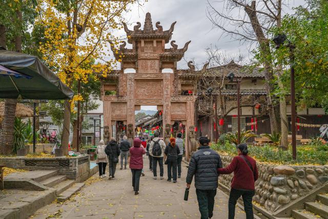 (251219) -- GUANGYUAN, Dec. 19, 2025 (Xinhua) -- Tourists visit Zhaohua ancient town in Zhaohua District of Guangyuan City, southwest China's Sichuan Province, Dec. 12, 2025. Zhaohua ancient town, located in Guangyuan City of southwest China's Sichuan Province, sits at the confluence of the Bailong River, the Jialing River, and the Qingjiang River. As a well-preserved ancient town, it carries a history of over 2,300 years.
    However, due to old infrastructure and unplanned construction, the ancient town once fell into disorder with residents living in the town having to undergo various difficulties. In order to refresh the ancient town, since 2012, Zhaohua District has launched a project to preserve the villages as a whole. While improving the village environment, the preservation project brings along local rural tourism, allowing the ancient town to be revitalized through preservation. (Photo by Wang Jun/Xinhua)