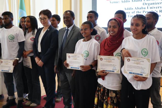 (251219) -- ADDIS ABABA, Dec. 19, 2025 (Xinhua) -- Participants of the 2025 China-Ethiopia Friendship Award pose for a group photo in Addis Ababa, the capital of Ethiopia, Dec. 19, 2025. TO GO WITH "Chinese scholarship awarded to Ethiopians to promote education, mutual understanding" (Xinhua/Liu Fangqiang)