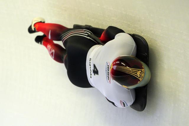 (251220) -- SIGULDA, Dec. 20, 2025 (Xinhua) -- Chen Wenhao of China competes during the Men's Skeleton heat at the IBSF World Cup Bobsleigh and Skeleton in Sigulda, Latvia, December 19, 2025. (Photo by Edijs Palens/Xinhua)