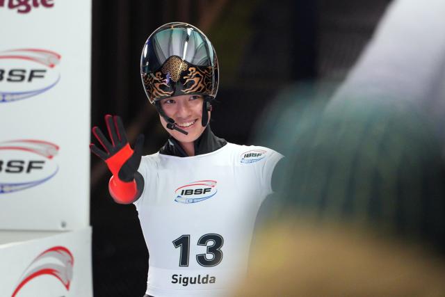 (251220) -- SIGULDA, Dec. 20, 2025 (Xinhua) -- Li Yuxi of China reacts after the Women's Skeleton heat at the IBSF World Cup Bobsleigh and Skeleton in Sigulda, Latvia, Dec. 19, 2025. (Photo by Edijs Palens/Xinhua)