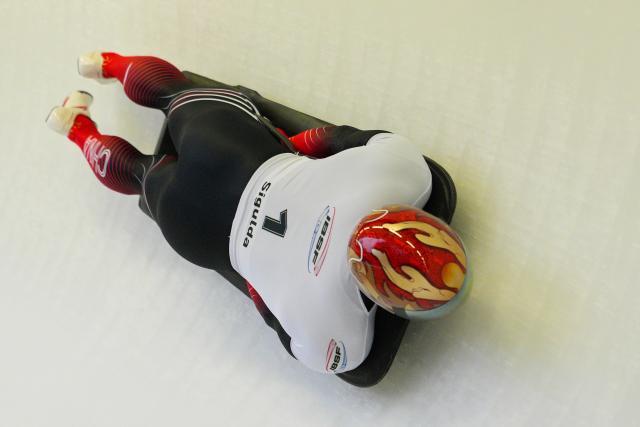 (251220) -- SIGULDA, Dec. 20, 2025 (Xinhua) -- Zhu Haifeng of China competes during the Men's Skeleton heat at the IBSF World Cup Bobsleigh and Skeleton in Sigulda, Latvia, Dec. 19, 2025. (Photo by Edijs Palens/Xinhua)