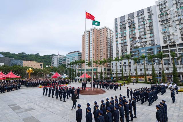(251220) -- MACAO, Dec. 20, 2025 (Xinhua) -- A flag-raising ceremony marking the 26th anniversary of Macao's return to the motherland is held at the Golden Lotus Square in Macao, south China, Dec. 20, 2025. (Xinhua/Cheong Kam Ka)