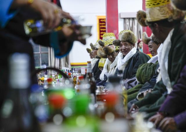 (251220) -- BURANG, Dec. 20, 2025 (Xinhua) -- Local residents celebrate the "Gutu Eve" in Khorchak Village, Burang County of Ngari Prefecture, southwest China's Xizang Autonomous Region, Dec. 18, 2025.
  Two days ahead of the Tibetan New Year is the traditional "Gutu Eve" for families to have a feast of "gutu", a traditional soup dish made of flour, at home. "Gu" in Tibetan means nine, which is a lucky number. "Tu" means "pasta." Nine different fillings like wool, charcoal and chili are placed inside the dough drops, and each of these fillings has a meaning. While in Burang, "Gutu" is a sort of porridge with nine ingredients and also a distinctive dish on the dinner table of the "Gutu Eve."
   In Khorchak Village of Burang County, Jamyang Drolma's family is bustling with New Year preparations at home. A pot of "Gutu" steams on the stove, while the "chema," a two-tier rectangular wooden box containing roasted barley and fried wheat grain, is placed to pray for harvest in the next year. This year, the family rejoiced over a bumper harvest of highland barley and peas. "Life is getting better and better, and our New Year celebrations are becoming more lively each year," Jamyang Drolma said with a smile. (Xinhua/Tenzin Nyida)