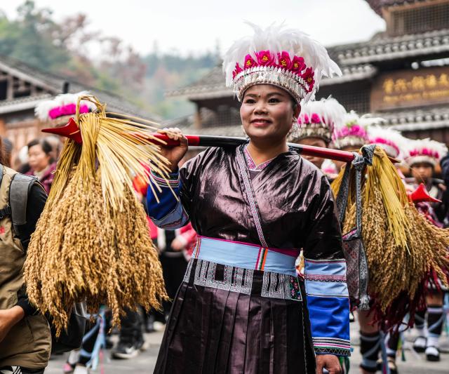 (251220) -- LIPING, Dec. 20, 2025 (Xinhua) -- A performance team parades during an event in celebration of Dong New Year at Zhaoxing Dong village of Liping County, Qiandongnan Miao and Dong Autonomous Prefecture, southwest China's Guizhou Province, Dec. 20, 2025. Dong New Year, a traditional festival for harvest and gathering, was enlisted as one of China's national intangible cultural heritages in 2011. Various activities were held in Liping County over the weekend. (Xinhua/Tao Liang)