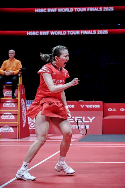 (251220) -- HANGZHOU, Dec. 20, 2025 (Xinhua) -- Wei Yaxin of China celebrates during the mixed doubles semifinal match between Jiang Zhenbang/Wei Yaxin of China and Chen Tang Jie/Toh Ee Wei of Malaysia at BWF World Tour Finals 2025 in Hangzhou, east China's Zhejiang Province, Dec. 20, 2025. (Xinhua/Jiang Han)