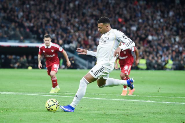 (251221) -- MADRID, Dec. 21, 2025 (Xinhua) -- Real Madrid's Kylian Mbappe takes a penalty to score during a La Liga football match between Real Madrid and Sevilla FC at Santiago Bernabeu stadium in Madrid, Spain, on Dec. 20, 2025. (Photo by Gustavo Valiente/Xinhua)