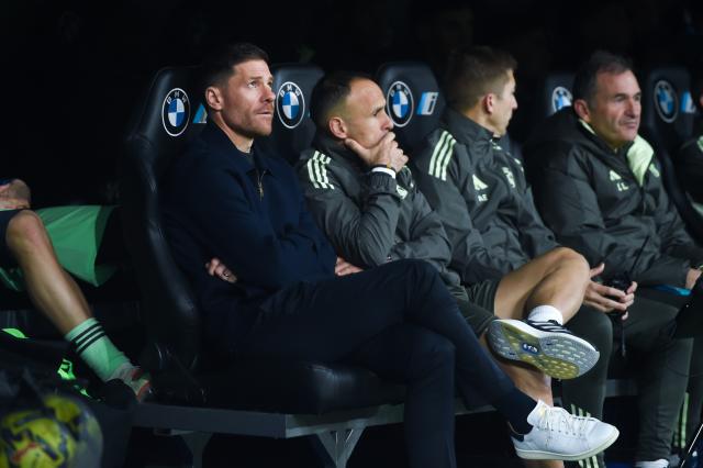 (251221) -- MADRID, Dec. 21, 2025 (Xinhua) -- Xabi Alonso (1st L), head coach of Real Madrid, reacts during a La Liga football match between Real Madrid and Sevilla FC at Santiago Bernabeu stadium in Madrid, Spain, on Dec. 20, 2025. (Photo by Gustavo Valiente/Xinhua)