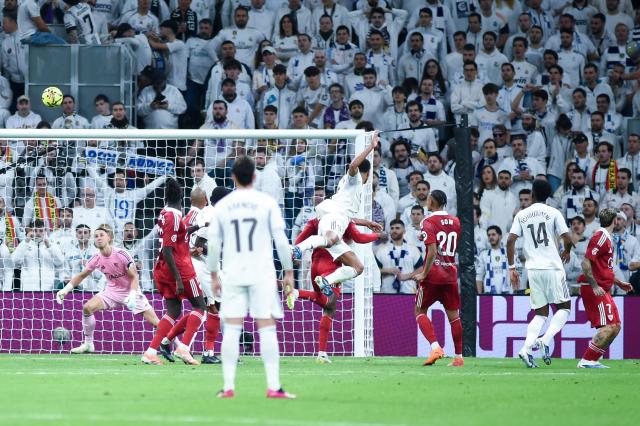 (251221) -- MADRID, Dec. 21, 2025 (Xinhua) -- Real Madrid's Jude Bellingham (4th R) scores during a La Liga football match between Real Madrid and Sevilla FC at Santiago Bernabeu stadium in Madrid, Spain, on Dec. 20, 2025. (Photo by Gustavo Valiente/Xinhua)