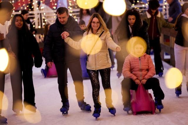 (251221) -- BEIJING, Dec. 21, 2025 (Xinhua) -- People skate at Villa Borghese in Rome, Italy, Dec. 20, 2025. The Villa Borghese, an urban park in Rome, has been filled with festive atmosphere as the Christmas approaches. (Xinhua/Li Jing)