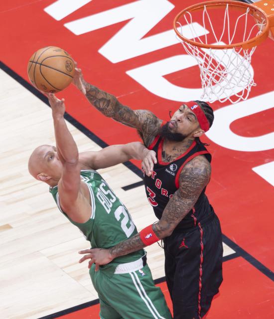 (251221) -- TORONTO, Dec. 21, 2025 (Xinhua) -- Brandon Ingram (R) of Toronto Raptors blocks Jordan Walsh of Boston Celtics during the 2025-2026 NBA regular season game between Toronto Raptors and Boston Celtics in Toronto, Canada, on Dec. 20, 2025. (Xinhua/Zou Zheng)