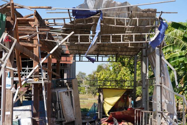 (251221) -- ODDAR MEANCHEY, Dec. 21, 2025 (Xinhua) -- A civilian house damaged by Thailand's artillery shelling is seen in Oddar Meanchey province, Cambodia, Dec. 20, 2025. The civilian death toll in Cambodia has increased to 19, as the renewed border conflict with Thailand has entered its 15th day, according to Cambodia's defense ministry. (Agence Kampuchea Presse/Handout via Xinhua)