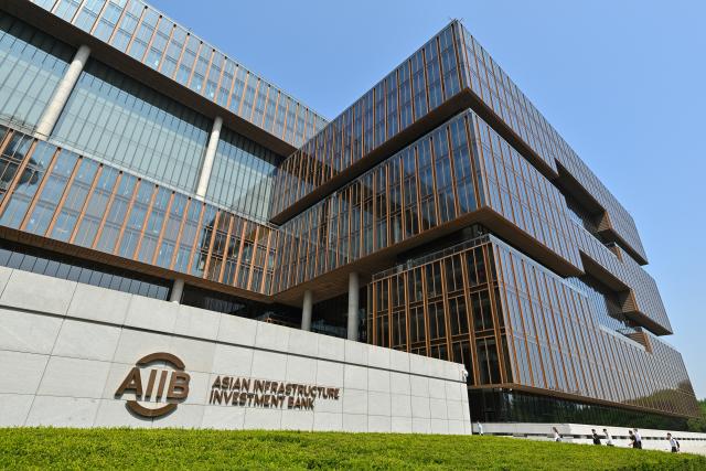 (251221) -- BEIJING, Dec. 21, 2025 (Xinhua) -- This photo taken on June 11, 2025 shows an exterior view of the headquarters of the Asian Infrastructure Investment Bank (AIIB) in Beijing, capital of China. (Xinhua/Li Xin)