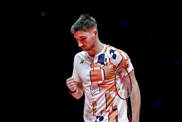 (251221) -- HANGZHOU, Dec. 21, 2025 (Xinhua) -- Christo Popov of France celebrates a score during the men's singles final against Shi Yuqi of China at BWF World Tour Finals 2025 in Hangzhou, east China's Zhejiang Province, Dec. 21, 2025. (Xinhua/Jiang Han)