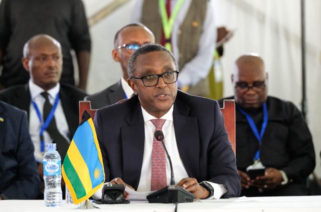 (251222) -- ENTEBBE, Dec. 22, 2025 (Xinhua) -- Rwandan Foreign Minister Vincent Biruta speaks at a one-day regional summit to address the rapidly worsening security situation in eastern Democratic Republic of the Congo (DRC) and its spillover across the Great Lakes region, held in Entebbe, Uganda, Dec. 21, 2025. African leaders on Sunday called for regional-led efforts to take the forefront in resolving the crisis in the Democratic Republic of the Congo (DRC), with international initiatives playing a supporting role.
   TO GO WITH "African leaders call for regional-led solution to DR Congo conflict" (Photo by Hajarah Nalwadda/Xinhua)