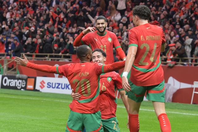 (251222) -- RABAT, Dec. 22, 2025 (Xinhua) -- Ayoub El Kaabi (1st L) of Morocco celebrates with teammates after scoring during the opening match of the Africa Cup of Nations 2025 between Morocco and Comoros in Rabat, Morocco, Dec. 21, 2025. (Photo by Aissa/Xinhua)