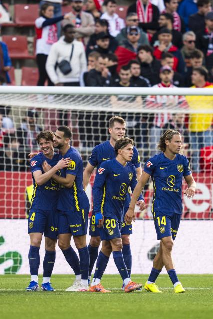 (251222) -- GIRONA, Dec. 22, 2025 (Xinhua) -- Players of Atletico de Madrid celebrate scoring during the La Liga football match between Girona FC and Atletico de Madrid in Montilivi Stadium, Girona, Spain, on Dec. 21, 2025. (Photo by Joan Gosa/Xinhua)