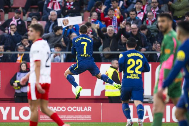 (251222) -- GIRONA, Dec. 22, 2025 (Xinhua) -- Antoine Griezmann (back) of Atletico de Madrid celebrates scoring during the La Liga football match between Girona FC and Atletico de Madrid in Montilivi Stadium, Girona, Spain, on Dec. 21, 2025. (Photo by Joan Gosa/Xinhua)