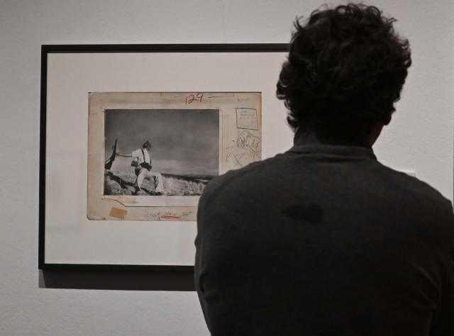 (251222) -- MADRID, Dec. 22, 2025 (Xinhua) -- A man visits the exhibition "Robert Capa: Icons" in Madrid, Spain, Dec. 20, 2025.
  The exhibition displays more than 250 items, including iconic shots, personal belongings, and documents that shed light on the life and work of Hungarian-American war photographer Robert Capa. (Xinhua/Cheng Min)