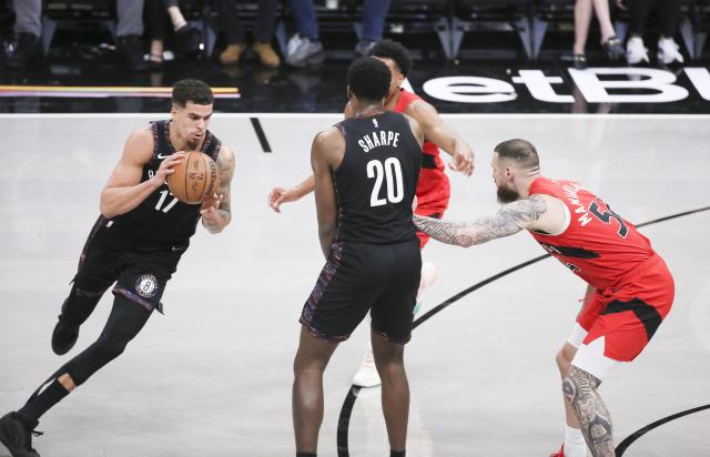 (251222) -- NEW YORK, Dec. 22, 2025 (Xinhua) -- Michael Porter Jr. (1st L) of Brooklyn Nets dribbles during the 2025-2026 NBA regular season game between Brooklyn Nets and Toronto Raptors in New York, the United States, Dec. 21, 2025. (Xinhua/Zhang Fengguo)