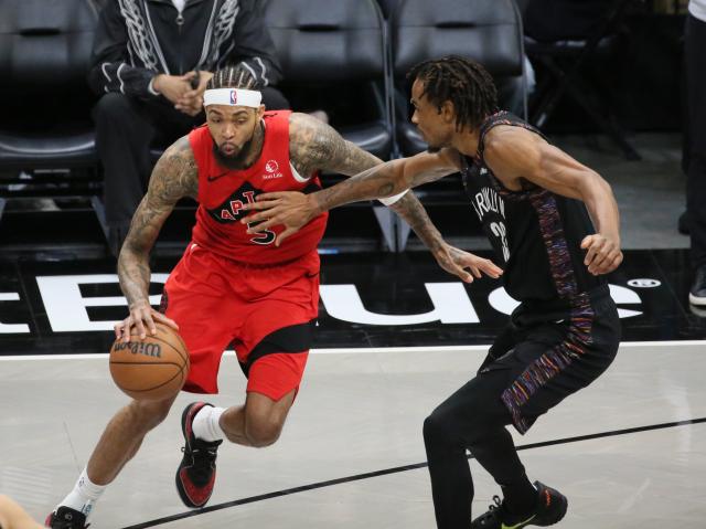 (251222) -- NEW YORK, Dec. 22, 2025 (Xinhua) -- Brandon Ingram (L) of Toronto Raptors dribbles during the 2025-2026 NBA regular season game between Brooklyn Nets and Toronto Raptors in New York, the United States, Dec. 21, 2025. (Xinhua/Zhang Fengguo)