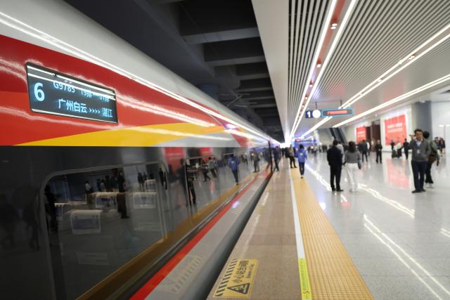 (251222) -- GUANGZHOU, Dec. 22, 2025 (Xinhua) -- Passengers prepare to board the first train of the Guangzhou-Zhanjiang High-Speed Railway at the Guangzhou Baiyun Railway Station in Guangzhou, south China's Guangdong Province, Dec. 22, 2025.
  Spanning approximately 401 kilometers, the Guangzhou-Zhanjiang High-Speed Railway began operation on Monday. With a designed top speed of 350 kilometers per hour, the travel time can be reduced to around one hour and a half between the Guangzhou Baiyun Railway Station and the Zhanjiang North Railway Station, both in Guangdong. (Xinhua/Lu Hanxin)