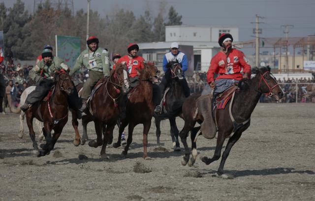 (251222) -- KABUL, Dec. 22, 2025 (Xinhua) -- Horse riders compete during a game of Buzkashi in Kabul, capital of Afghanistan, Dec. 21, 2025. TO GO WITH "Feature: Buzkashi promotes unity in Afghanistan as thriving national game" (Photo by Saifurahman Safi/Xinhua)