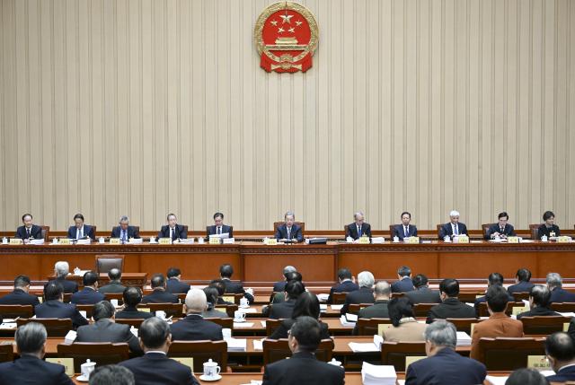 (251222) -- BEIJING, Dec. 22, 2025 (Xinhua) -- Zhao Leji, chairman of the National People's Congress (NPC) Standing Committee, presides over the first plenary meeting of the 19th session of the 14th NPC Standing Committee at the Great Hall of the People in Beijing, capital of China, Dec. 22, 2025. (Xinhua/Zhang Ling)