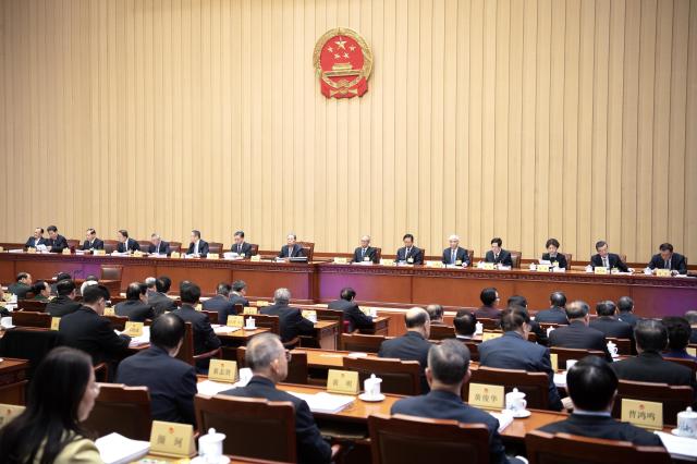 (251222) -- BEIJING, Dec. 22, 2025 (Xinhua) -- Zhao Leji, chairman of the National People's Congress (NPC) Standing Committee, attends the second plenary meeting of the 19th session of the 14th NPC Standing Committee at the Great Hall of the People in Beijing, capital of China, Dec. 22, 2025. (Xinhua/Li Tao)