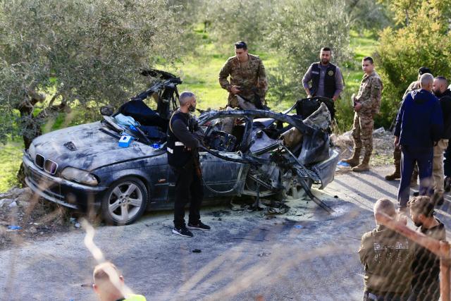 (251222) -- SIDON, Dec. 22, 2025 (Xinhua) -- This photo taken on Dec. 22, 2025 shows the site of an Israeli drone strike targeting a car on the Aaqtnait-Quneitra-Maamariyah road in the Sidon, Lebanon. Three people were killed Monday in an Israeli drone strike deep in southern Lebanon, according to Lebanese sources. (Photo by Ali Hashisho/Xinhua)