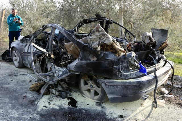 (251222) -- SIDON, Dec. 22, 2025 (Xinhua) -- This photo taken on Dec. 22, 2025 shows the site of an Israeli drone strike targeting a car on the Aaqtnait-Quneitra-Maamariyah road in the Sidon, Lebanon. Three people were killed Monday in an Israeli drone strike deep in southern Lebanon, according to Lebanese sources. (Photo by Ali Hashisho/Xinhua)