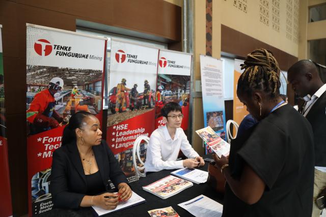 (251222) -- KINSHASA, Dec. 22, 2025 (Xinhua) -- Congolese people learn about a Chinese company on the sidelines of the Sino-Congolese conference on vocational and technical training in Kinshasa, Democratic Republic of the Congo (DRC), on Dec. 22, 2025. The Sino-Congolese conference on vocational and technical training was held on Monday in Kinshasa, the capital of the DRC, aiming to strengthen bilateral cooperation. (Str/Xinhua)