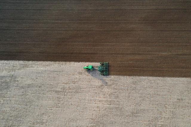 (251223) -- BET SHEMESH, Dec. 23, 2025 (Xinhua) -- An aerial drone photo taken on Dec. 22, 2025 shows a tractor working in a farm field in Bet Shemesh, Israel. Israel has experienced unusually early and heavy rains this winter, with precipitation in many areas already reaching the annual average. The rainfall has eased drought conditions in some parts of the country. (Photo by Gil Cohen Magen/Xinhua)