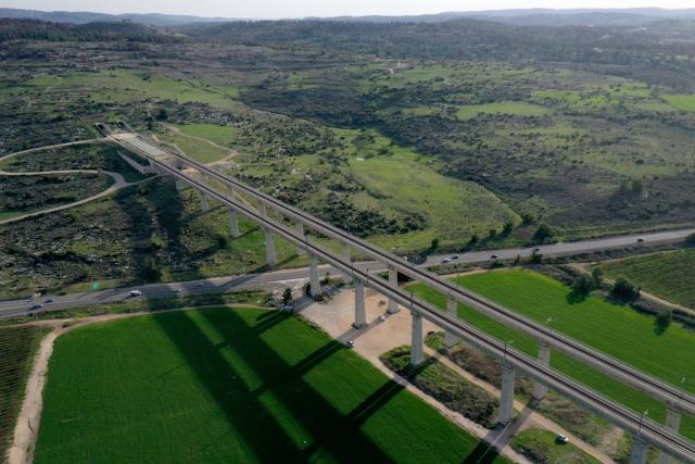 (251223) -- BET SHEMESH, Dec. 23, 2025 (Xinhua) -- A drone photo taken on Dec. 22, 2025 shows rail tracks running through farm fields near Bet Shemesh, Israel. Israel has experienced unusually early and heavy rains this winter, with precipitation in many areas already reaching the annual average. The rainfall has eased drought conditions in some parts of the country. (Photo by Gil Cohen Magen/Xinhua)