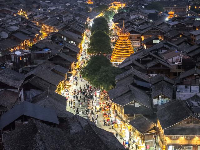 (251223) -- LIPING, Dec. 23, 2025 (Xinhua) -- An aerial drone photo shows tourists visiting the Zhaoxing Dong village of Liping County, southwest China's Guizhou Province, Dec. 20, 2025.
  Zhaoxing Dong village, home to a captivating cultural landscape, has seen an influx of tourists as the Dong New Year approaches.
  In recent years, the local government has leveraged the village's rich Dong ethnic cultural resources in developing the tourism industry.
  Boosted by tourism and other feature industries, the local Dong people have improved their living standards by inheriting traditional craftsmanship, developing ethnic handicrafts, launching cultural and creative products, and expanding the homestay and catering businesses. (Xinhua/Yang Wenbin)