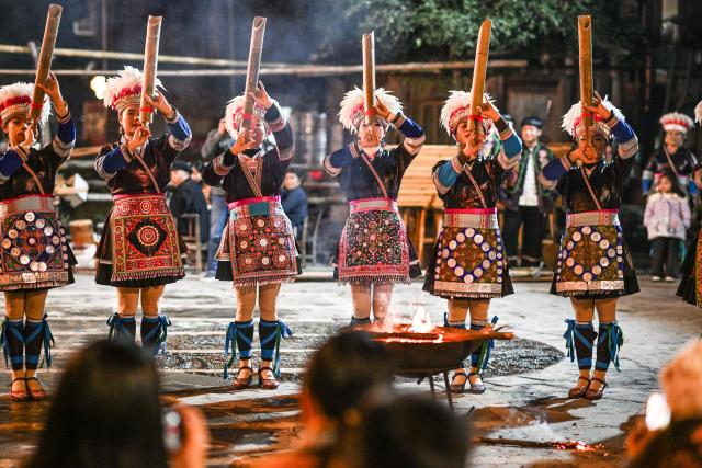 (251223) -- LIPING, Dec. 23, 2025 (Xinhua) -- A folk performance is staged for tourists in Zhaoxing Dong village of Liping County, southwest China's Guizhou Province, Dec. 19, 2025.
  Zhaoxing Dong village, home to a captivating cultural landscape, has seen an influx of tourists as the Dong New Year approaches.
  In recent years, the local government has leveraged the village's rich Dong ethnic cultural resources in developing the tourism industry.
  Boosted by tourism and other feature industries, the local Dong people have improved their living standards by inheriting traditional craftsmanship, developing ethnic handicrafts, launching cultural and creative products, and expanding the homestay and catering businesses. (Xinhua/Yang Wenbin)