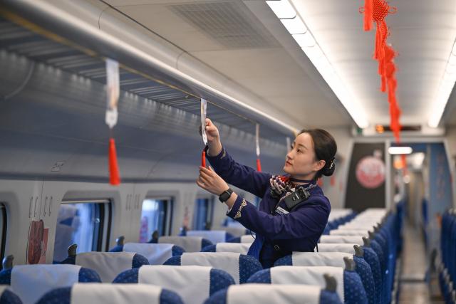 (251223) -- BAOTOU, Dec. 23, 2025 (Xinhua) -- A railway crew member makes preparations on bullet train No.D4667, which is about to depart from Baotou Railway Station in Baotou, north China's Inner Mongolia Autonomous Region, Dec. 23, 2025. The Baotou-Huinong section of the Baotou-Yinchuan High-Speed Railway was completed and opened to traffic on Tuesday, marking the full-line operation of the railway.
  This railway connects Baotou in north China's Inner Mongolia Autonomous Region with Yinchuan in northwest China's Ningxia Hui Autonomous Region, enhancing the high-speed railway network in northwest China. (Xinhua/Li Zhipeng)