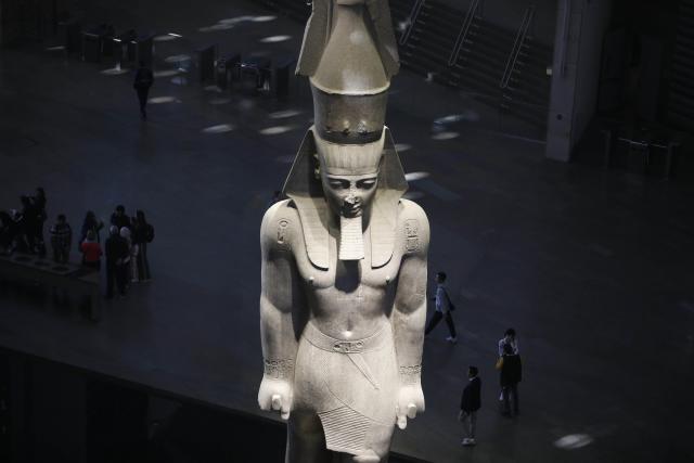 (251223) -- CAIRO, Dec. 23, 2025 (Xinhua) -- This photo taken on Dec. 23, 2025 shows the Colossal Statue of Ramesses II at the Grand Egyptian Museum in the Greater Cairo, Egypt. The Grand Egyptian Museum opened its doors to the public on Nov. 4, establishing itself as one of the world's largest displays of ancient relics, and a high-tech fort dedicated to heritage conservation. (Xinhua/Ahmed Gomaa)