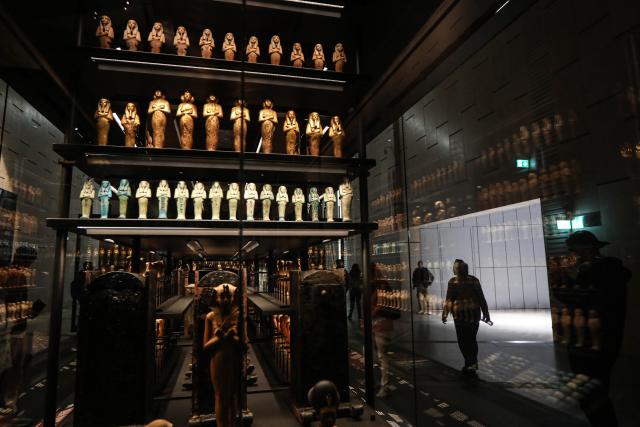 (251223) -- CAIRO, Dec. 23, 2025 (Xinhua) -- Artifacts are displayed at the Grand Egyptian Museum in the Greater Cairo, Egypt, Dec. 23, 2025. The Grand Egyptian Museum opened its doors to the public on Nov. 4, establishing itself as one of the world's largest displays of ancient relics, and a high-tech fort dedicated to heritage conservation. (Xinhua/Ahmed Gomaa)