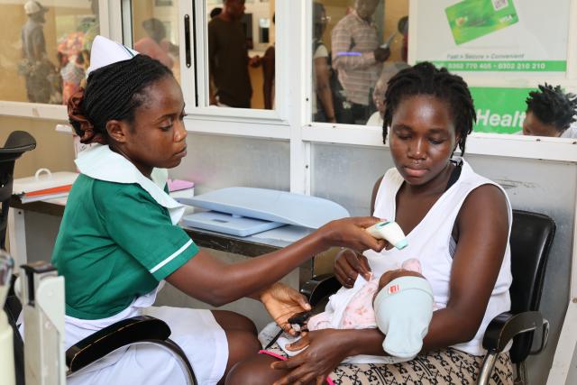 (251224) -- ACCRA, Dec. 24, 2025 (Xinhua) -- A nurse conducts a medical checkup for a baby at the China-Ghana Friendship Hospital in Accra, the capital of Ghana, Dec. 23, 2025. The hospital, also known as Lekma Hospital, on Tuesday marked the 15th anniversary of its establishment here.
   TO GO WITH "China-Ghana Friendship Hospital marks 15th anniversary" (Photo by Seth/Xinhua)