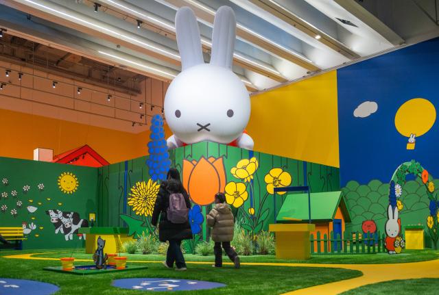 (251224) -- BEIJING, Dec. 24, 2025 (Xinhua) -- People visit the exhibition "Miffy and Friends China Experience" at the Times Art Museum in Beijing, capital of China, Dec. 24, 2025. Miffy is a world-famous cartoon rabbit created by Dutch artist Dick Bruna. The exhibition opened here on Wednesday and will last until March 22, 2026. (Xinhua/Hu Jingwen)