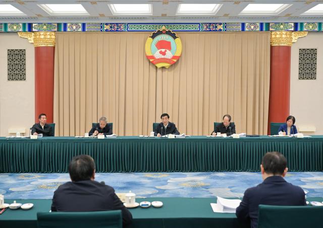(251224) -- BEIJING, Dec. 24, 2025 (Xinhua) -- Wang Huning, a member of the Standing Committee of the Political Bureau of the Communist Party of China (CPC) Central Committee and chairman of the Chinese People's Political Consultative Conference (CPPCC) National Committee, presides over the 45th Chairperson's Council meeting of the 14th CPPCC National Committee and delivers a speech, in Beijing, capital of China, Dec. 24, 2025. (Xinhua/Gao Jie)