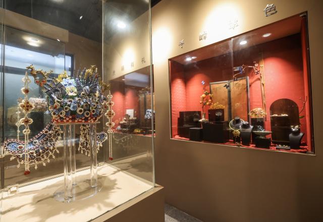 (251224) -- CIXI, Dec. 24, 2025 (Xinhua) -- Exhibits are pictured at an intangible cultural heritage workshop in an art village in Kuangyan Town, Cixi City, east China's Zhejiang Province, Dec. 24, 2025. In recent years, Kuangyan Town has built an art village integrated with cultural tourism to develop local rural industries and promote rural revitalization. (Xinhua/Xu Yu)