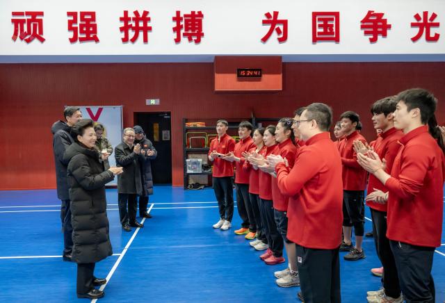 (251224) -- BEIJING, Dec. 24, 2025 (Xinhua) -- Chinese State Councilor Shen Yiqin meets with athletes, coaches and staff members at the Winter Sports Administration Center under the General Administration of Sport of China in Beijing, capital of China, Dec. 24, 2025. Shen called on China's winter Olympic athletes to be better prepared for the Milan-Cortina 2026 Games and strive for glory for their nation. (Xinhua/Zhai Jianlan)