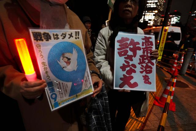 (251225) -- BEIJING, Dec. 25, 2025 (Xinhua) -- People holding signs attend a rally in front of the Japanese Prime Minister's Office in Tokyo, Japan, Dec. 23, 2025. Japanese citizens held a rally on Tuesday evening in front of the Prime Minister's Office in Tokyo, demanding that Prime Minister Sanae Takaichi retract her erroneous remarks on Taiwan and criticizing comments by a senior government official advocating nuclear armament. (Xinhua/Jia Haocheng)