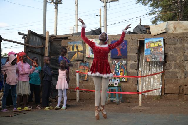 (251225) -- NAIROBI, Dec. 25, 2025 (Xinhua) -- A young dancer performs on a simple stage at the Kibera slum in Nairobi, Kenya, Dec. 23, 2025. A Christmas ballet performance organized by the Kibera Ballet School was held here on Tuesday, attracting many local residents to watch. (Xinhua/Yang Guang)