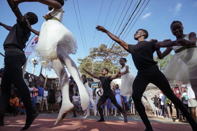 (251225) -- NAIROBI, Dec. 25, 2025 (Xinhua) -- Young dancers perform on a simple stage at the Kibera slum in Nairobi, Kenya, Dec. 23, 2025. A Christmas ballet performance organized by the Kibera Ballet School was held here on Tuesday, attracting many local residents to watch. (Xinhua/Han Xu)