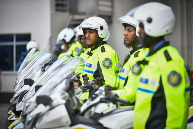 (251225) -- ADDIS ABABA, Dec. 25, 2025 (Xinhua) -- Ethiopian police officers stand next to the motorcycles donated by China to the Ethiopian Federal Police Commission in Addis Ababa, the capital of Ethiopia, Dec. 23, 2025. TO GO WITH "China donates motorcycles to Ethiopian police" (Photo by Michael Tewelde/Xinhua)